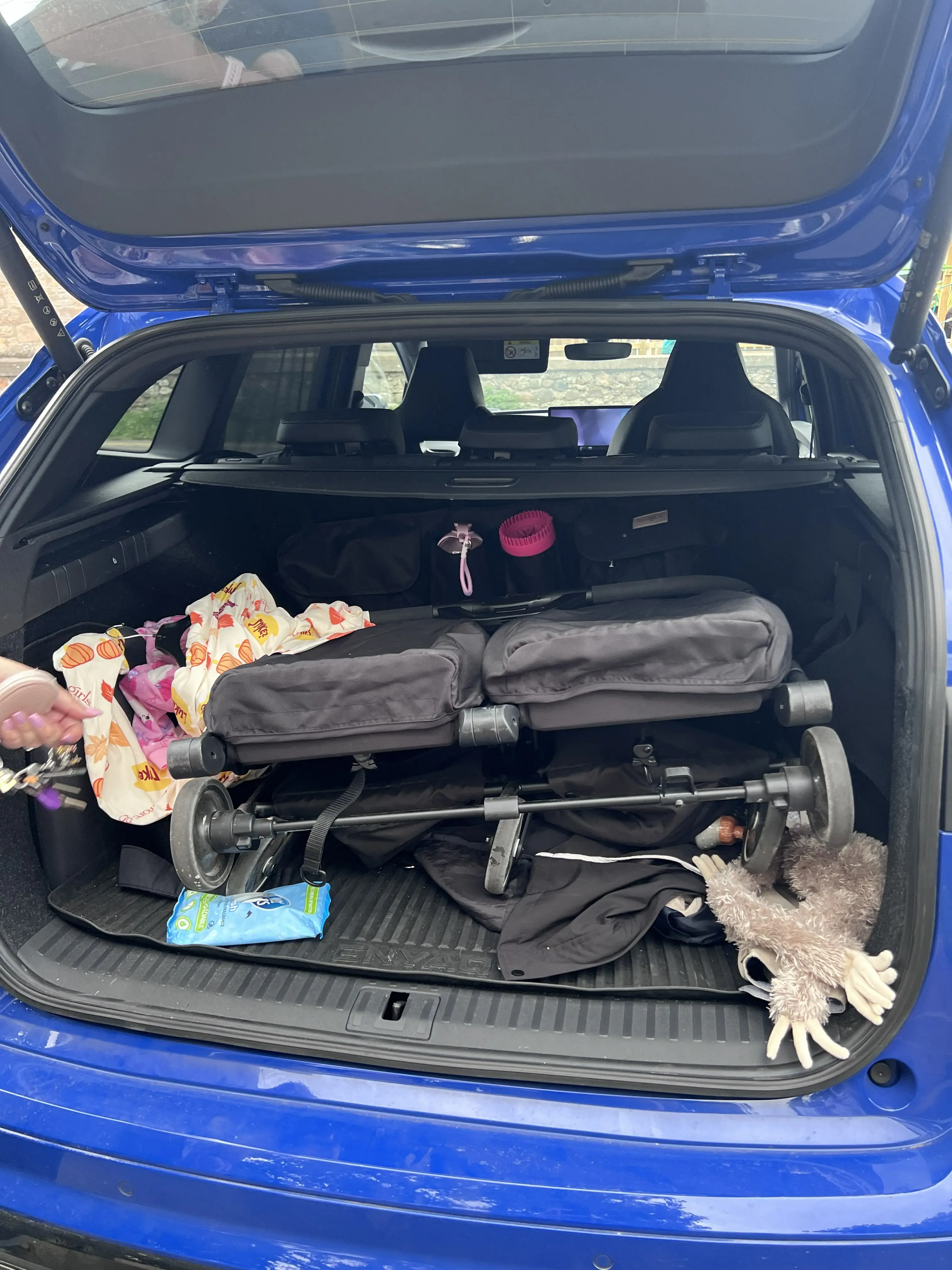 Puggle City Traveller folded in Skoda Enyaq boot fitting comfortably
