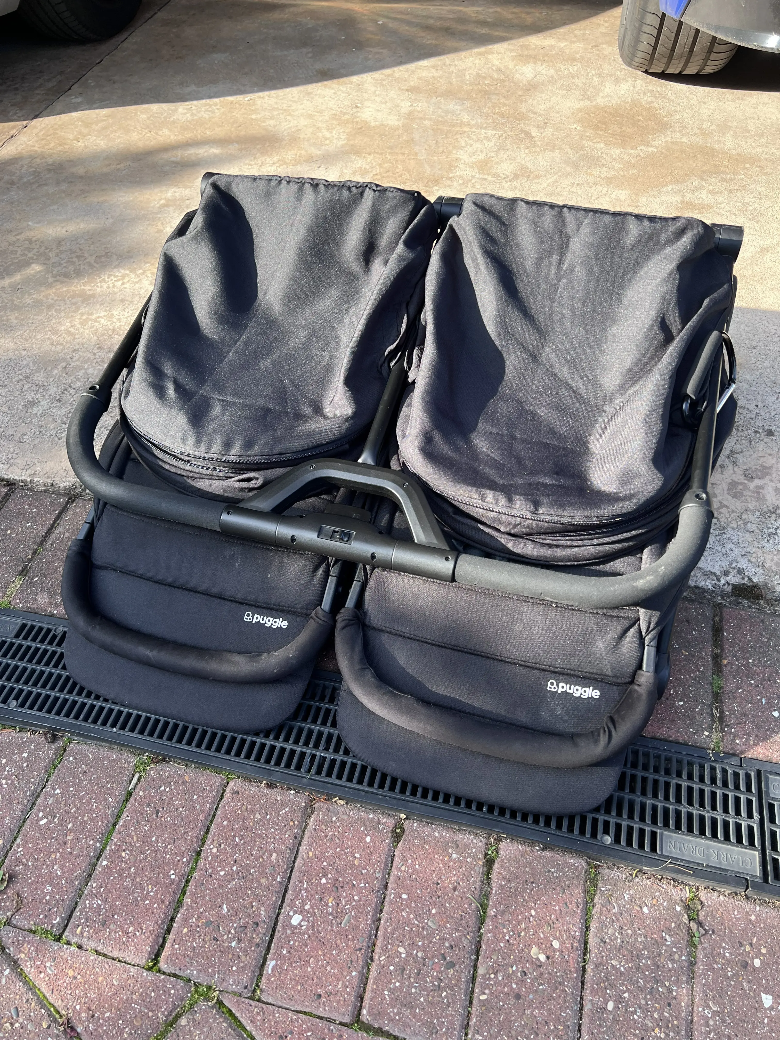 Puggle City Traveller double pushchair folded flat